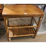 An oak 20th century swivel top folding table