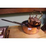 A Victorian copper kettle and a copper pan with lid