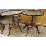 A pair of reproduction oval coffee tables, leather inset tops