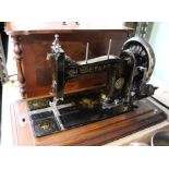 A PFAFF sewing machine in a mahogany & walnut veneer case