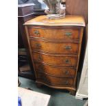 A Bevan Funnell reproduction walnut five drawer serpentine fronted chest