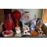 A box containing a selection of ceramics, including vases and animal figures