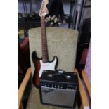 A Fender Squire Sunburst Strat (recently professionally set up) with a Fender 15 watt amp