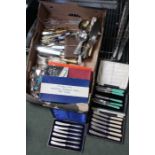 A box containing a large selection of cutlery some boxed