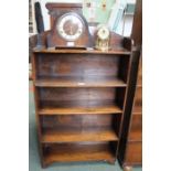 A small oak open fronted set of adjustable shelves