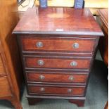 A reproduction mahogany small sized four drawer chest, with bracket feet