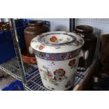 Two stoneware crock pots with twin handled casserole and a brightly floral decorated slop pale