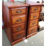 A matching pair of Rosewood and mahogany four drawer cabinets