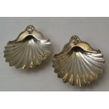 Charles Aldridge and Henry Green, a pair of George lll silver scallop form dishes, raised on shell f