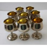 A set of eight silver goblets, gilded interiors commemorating The Silver Wedding Anniversary of HRH