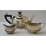 An Edwardian silver bachelor teapot, of Georgian design, together with a matching silver sugar bowl,