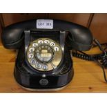 A vintage Belgian bell dial telephone, converted for modern telecommunications
