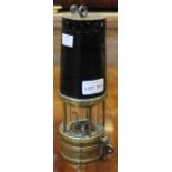 An original brass based miners lamp by Richard Johnson of Manchester & Liverpool, having various imp