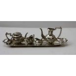 A late 20th century miniature silver tea set on tray, London 1973