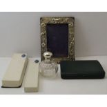 An Edwardian silver mounted photograph frame, with embossed Art Nouveau decoration, Chester 1903, to