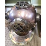 A reproduction metal divers helmet, copper and brass