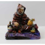 A Royal Doulton figure called "The Potter" HM1493 18 cm high