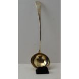 An 18th century silver soup ladle, gilded interior to the bowl. Old English pattern handle, with eng