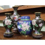 A collection of Chinese cloisonné wares, includes a pair of black ground vases on wooden stands, a b