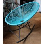 A retro design metal based rocking chair, with aquamarine rubberised webbing