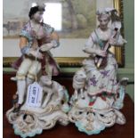 A pair of Derby porcelain figures, a shepherd with his dog & shepherdess with lamb
