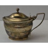 Thomas Wallis, a Georgian silver mustard pot, oval form, engraved leaf band decoration, with hinged