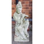 An garden statue of a musical lady
