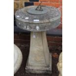 A stone sundial on non matching plinth