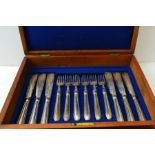 A Victorian mahogany canteen of silver plated fish knives & forks, with engraved decoration, for 18