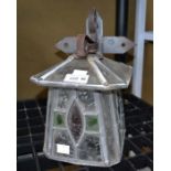 A stained glass wall mounted porch lantern