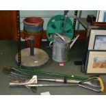 A selection of gardening tools, various including hose reel brolly stand etc