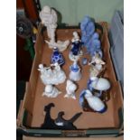 A selection of porcelain figurines both human and avian.