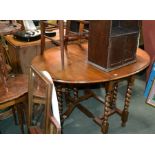 A late 19th century large drop leaf table