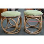 A pair of circular style foot stools