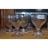 A set of six etched antique glasses together with a plain pair