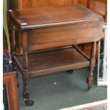 A oak two tier tea trolley