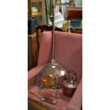 A collection of copper and brass wares, includes a Kettle, table gong with hammer, embossed copper c