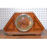 An art deco design wooden mantle clock