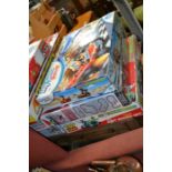 Three boxed car racing games to include Toy Story and My Sims Scalextric and Real FX