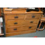 A Satinwood two over two drawer chest of drawers