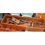 A wooden box containing various vintage woodworking tools etc