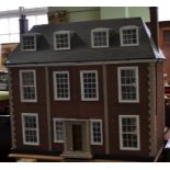 A fully furnished Georgian style scratch built dollhouse having three storeys 95h, 101w 44d cm