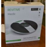 A Revitive Medic circulation booster, boxed.