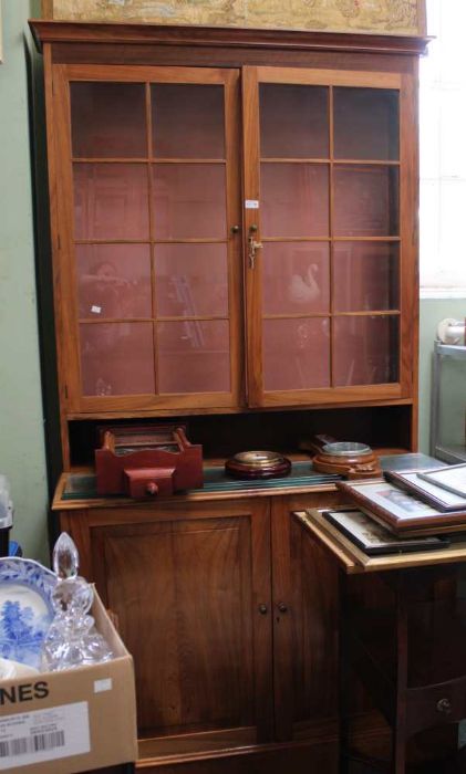 A Georgian design walnut display cabinet, two glazed doors over two cupboard doors below, 111cm x 20