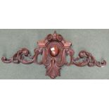 A mahogany carved overdoor decoration