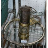 a vintage miners lamp, a trivet and a tray