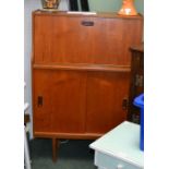 A retro teak bar cocktail cabinet