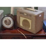 An oak cased mantel clock and a vintage Bush radio