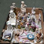 A box containing a selection of porcelain figurines etc