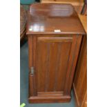 A mahogany bedside cupboard